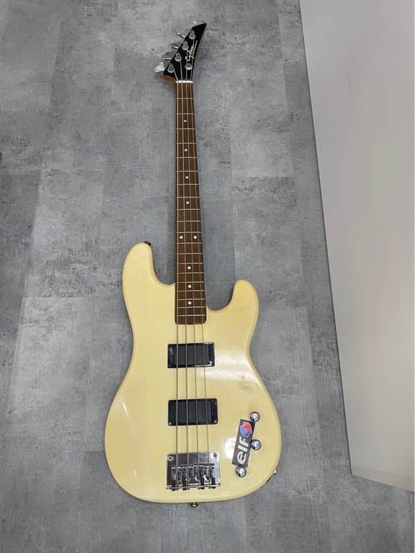 Đàn guitar điện guitar Bass Cyclone by EKS Technology Inc - Màu vàng - Ngoại hình: 97% - trầy xước, tróc sơn, rỉ sét, nứt nhẹ - Kèm túi