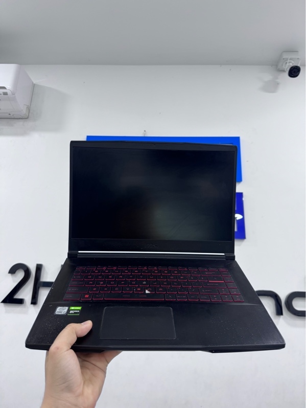 Laptop MSI GF63 Thin 10SC - i7-10750H - 8/512SSD - card GeForce GTX1650 - Màu đen-Pin 86%-NH97%-Mặt lưng trầy xước, mất 1 ốc đáy, mất 2 chân cao su, trầy xước, phím N bể, sức khoẻ ổ 91% - Kèm sạc