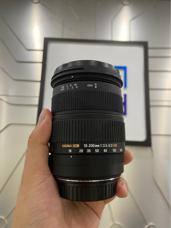 Lens Sigma DC 18-200mm - 1:3.5-6.5 HSM Macro 0.45/1.48ft for Canon - Màu đen - Ngoại hình: 98% - Bụi trong - Body