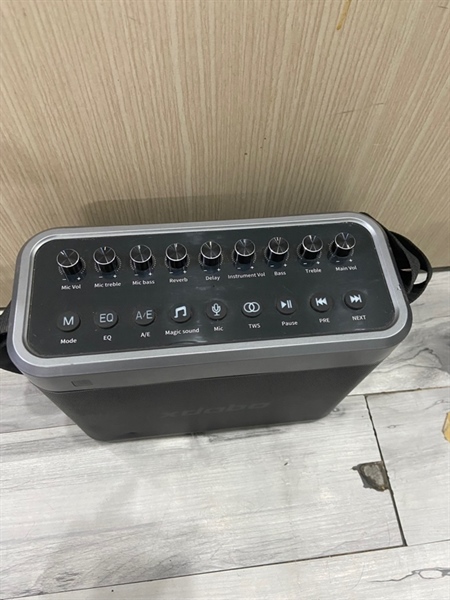 Loa Karaoke Xdobo Tuner - Màu đen - Ngoại hình: 97% - Móp lưới vài chỗ, trầy cấn - Kèm dây đeo, 2 mic, remote 1