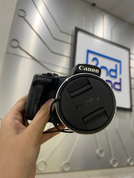Máy ảnh Canon SX50HS - Màu đen - Ngoại hình: 97% - Màn tối viền, trầy ống ngắm, nhiều đốm đen, mất nắp cổng kết nối, mất đệm báng tay cầm - Kèm 1 pin + dock sạc